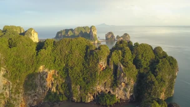 Aerial Flying Large Limestone Cliff Covered Lush Tropical Greenery Sunny — Stock Video