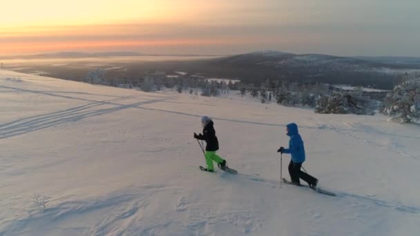 Aerial Active Couple Warm Winter Ware Snowshoeing Snowy Mountain Sunrise — Stock Video