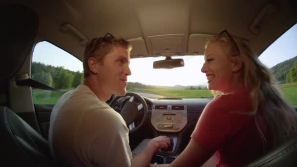 Slow Motion Close Carefree Caucasian Couple Kisses While Drive Empty — Stock Video