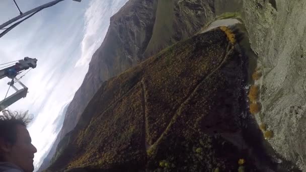 Selfie Cheerful Young Man Goes Bungee Jumping Breathtaking Sunny Mountains — Stock Video