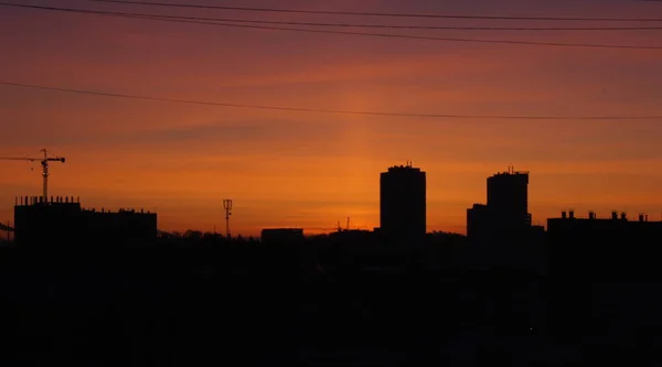 Evening sunset among high-rise buildings