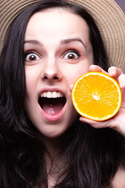 beautiful young girl with oranges, hat