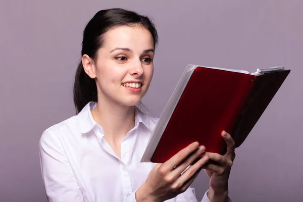 Girl White Shirt Holds Red Notebook Her Hand Royalty Free Stock Photos