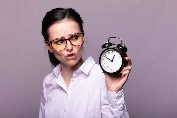Girl White Shirt Glasses Holds Alarm Clock Her Hand — Stock Photo, Image