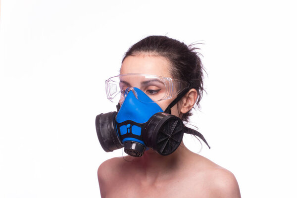 beautiful young girl in a respiratory mask