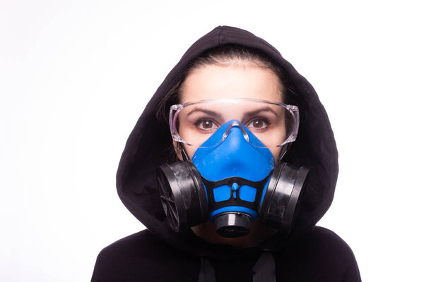 beautiful young girl in a respiratory mask