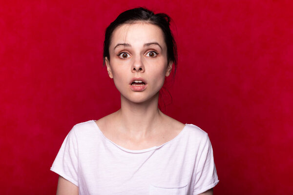 woman in  t-shirt on a red background