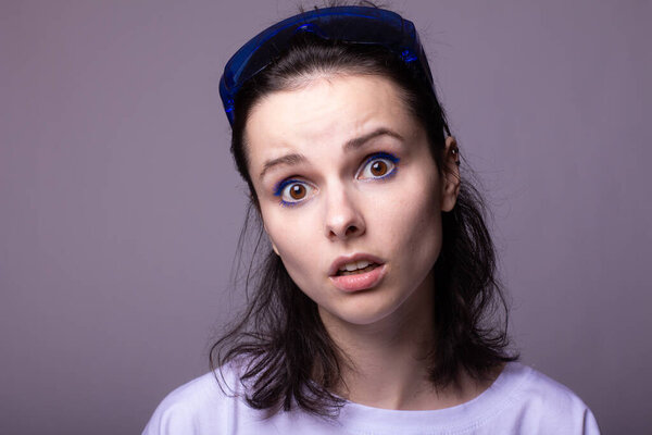 woman in white t-shirt on gray background