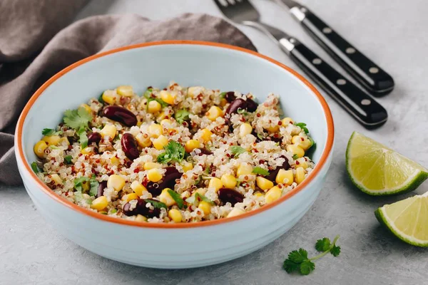 Quinoa salad with sweet corn, black beans and cilantro. Lime dressing