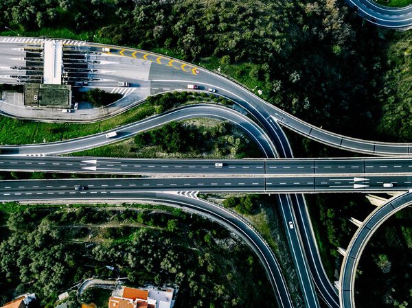 Aerial view of highway, expressway and motorway with a toll payment point in Italy