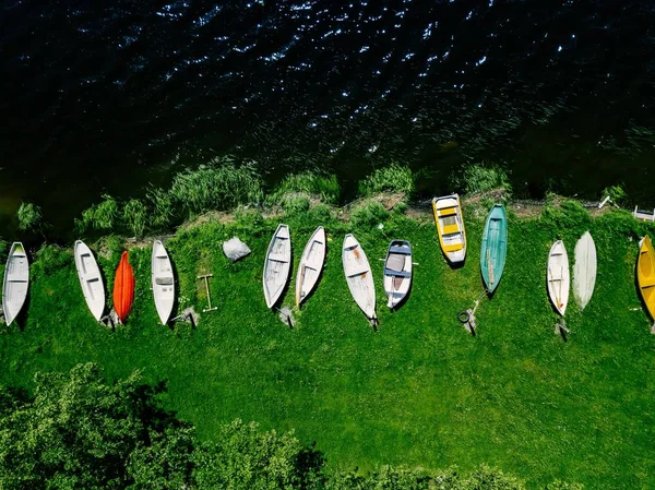 Aerial view of colorful  boats in a row on the shore of lake in Finland — Stock Photo, Image