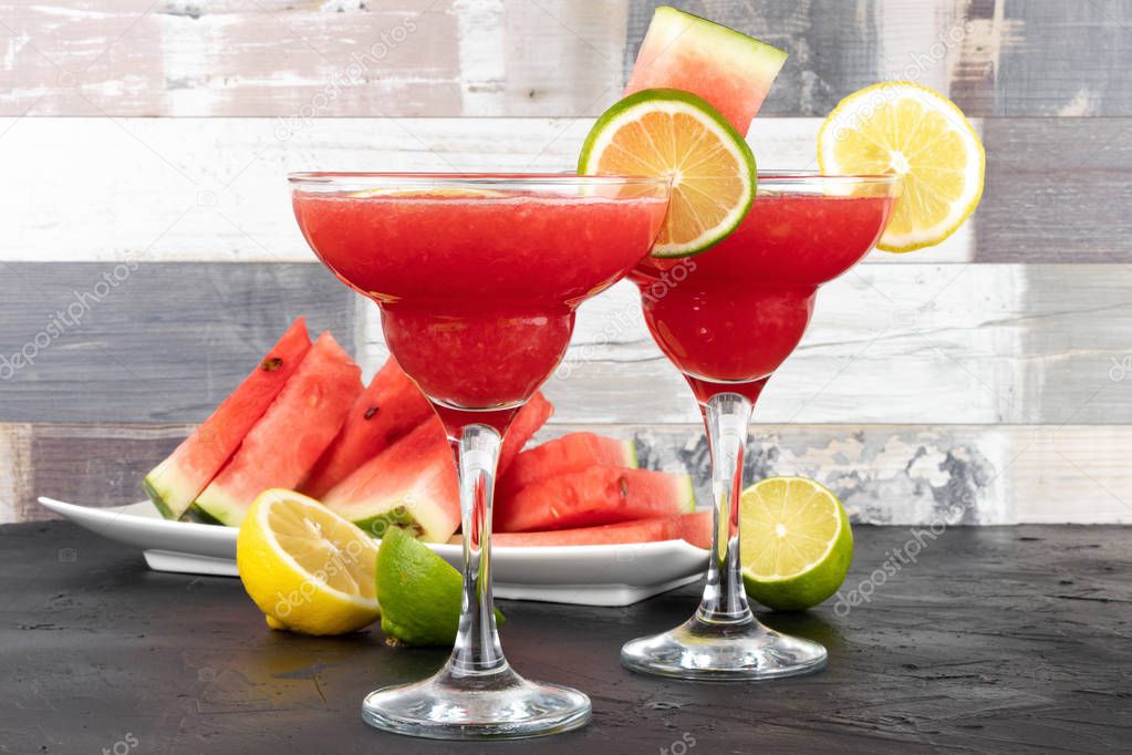 Watermelon smoothie with lime and mint with slices of watermelon. 