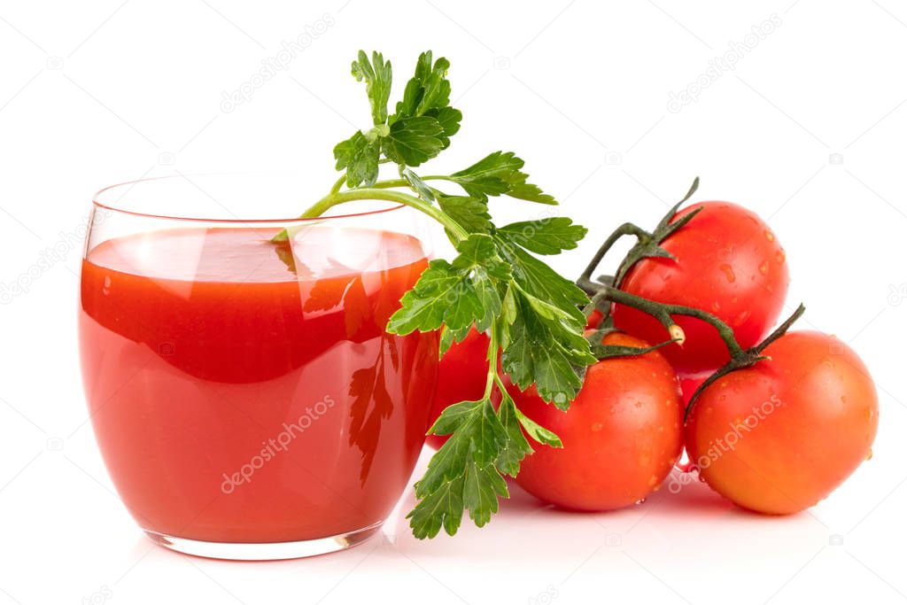 A glass of tomato juice with fresh ripe tomatoes and parsley on a white isolated background