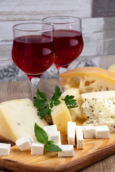 Different Types Cheeses Glass Wine Wooden Cutting Board — Stock Photo, Image