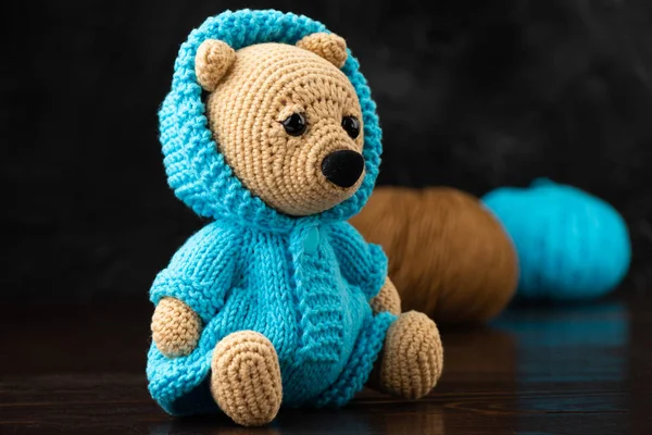 Funny knitted toy bear. Amigurumi toy. Crochet stuffed animals.