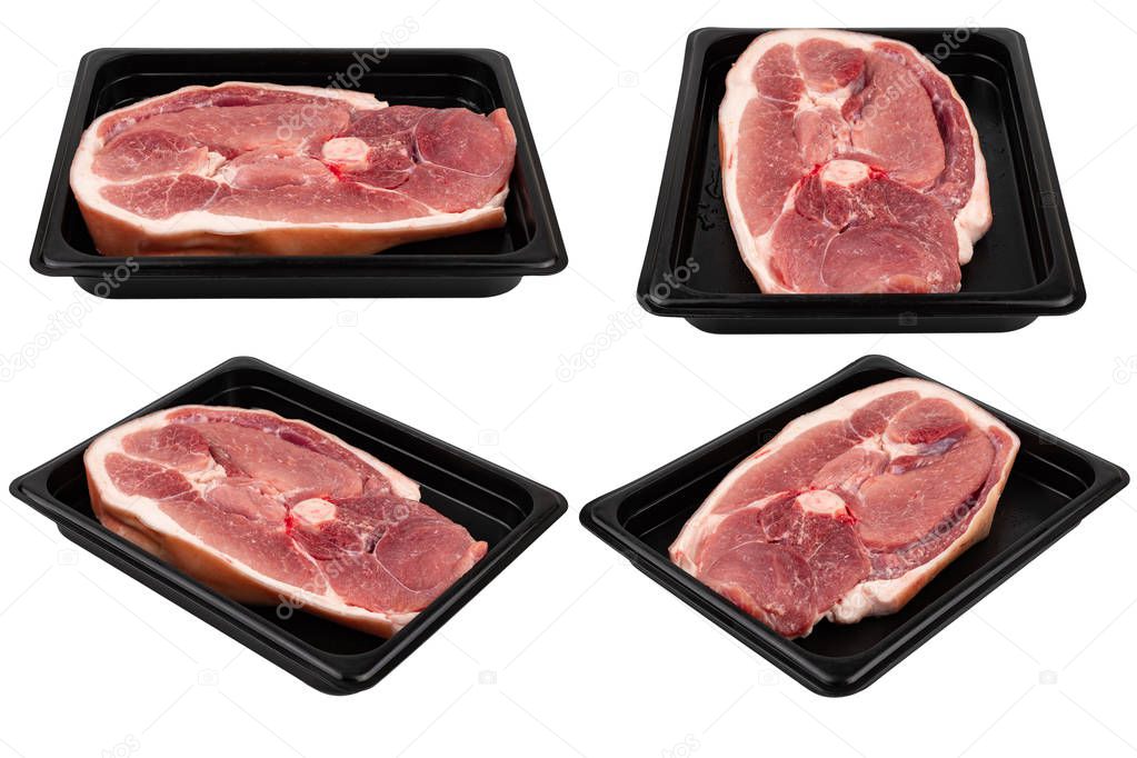 Pieces of fresh raw meat packed in plastic packaging. Ready for sale. White isolated.
