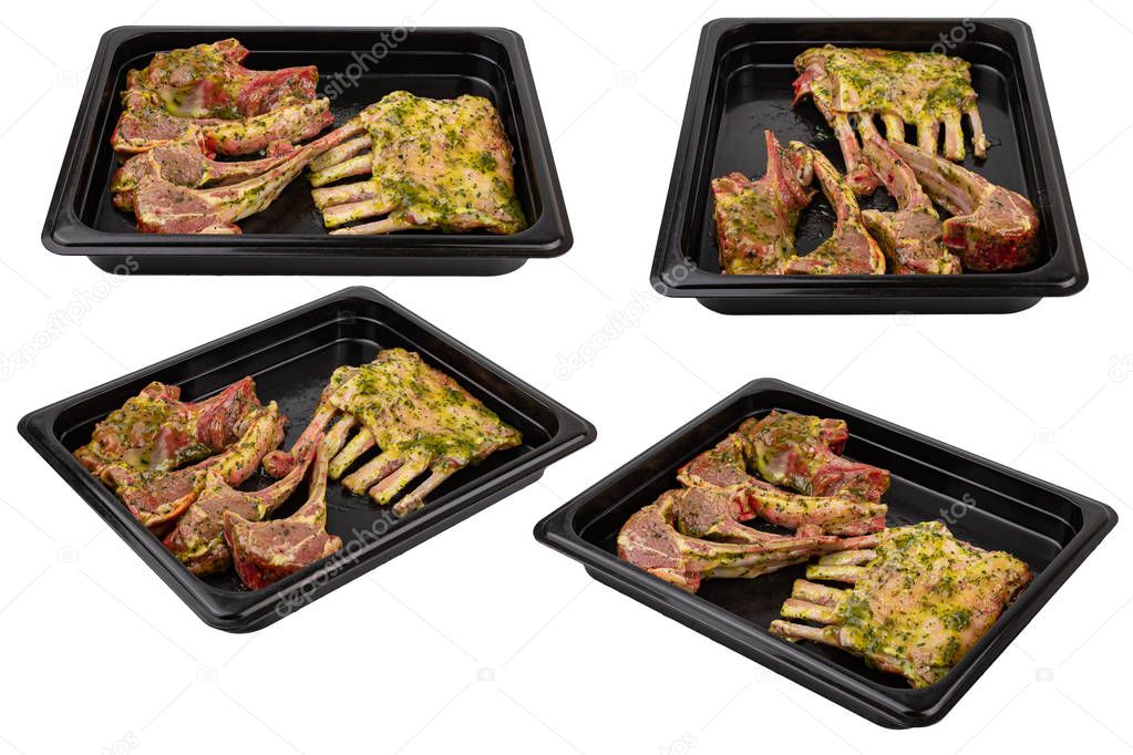 Pieces of fresh raw meat in a black plastic container on a white isolated background. Ready for sale. 