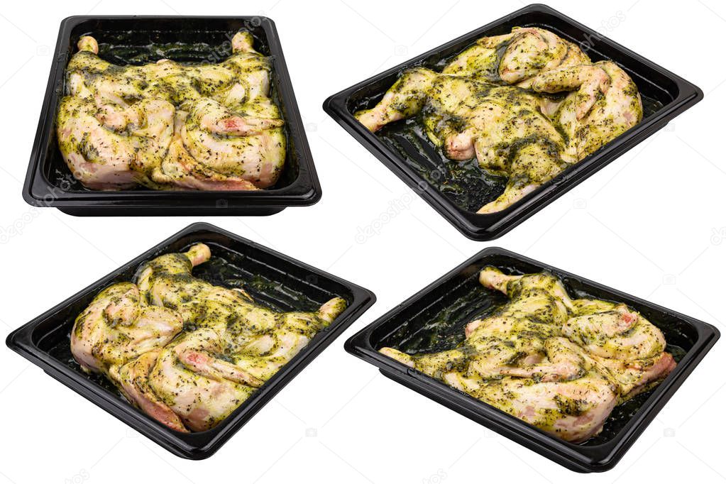 Marinated chicken in a black plastic container Ready for sale. White isolated.