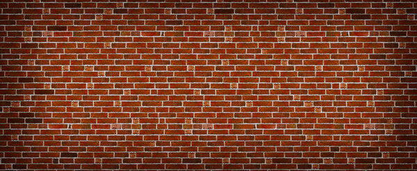 Red brick wall with vignette effect. Background texture