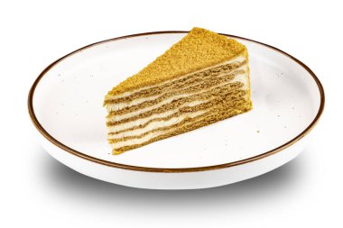 Tatlı. Aydınlatma tabağındaki kek parçası beyaz izole arkaplanı kapat