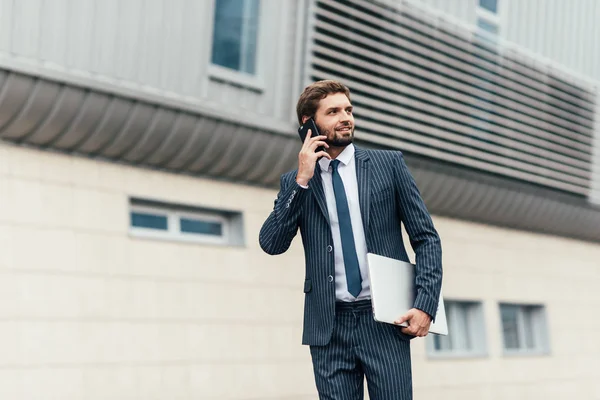 Man speaking by phone at street