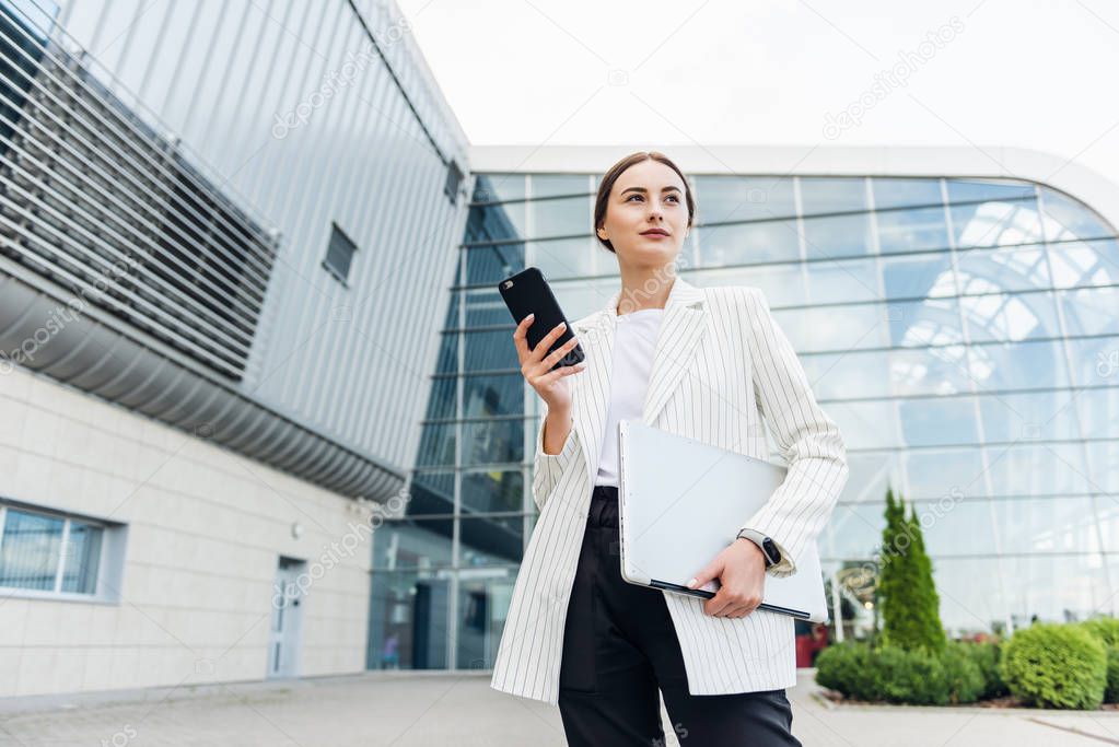 Business Woman Using Phone Near Office