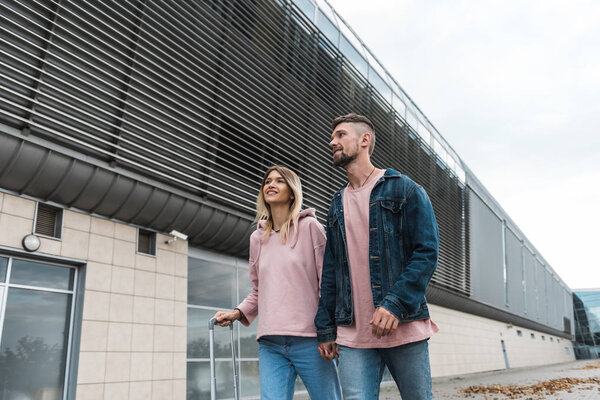 Couple travel with suitcases at the airport. Love with technology concept travel and transportation.