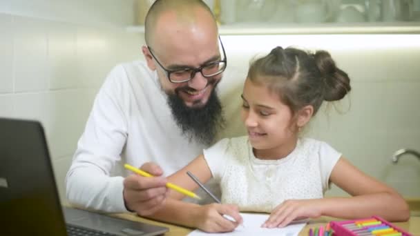 Father and daughter doing homework together. — Stock Video