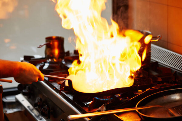 Flambe Food In The Restaurant Kitchen