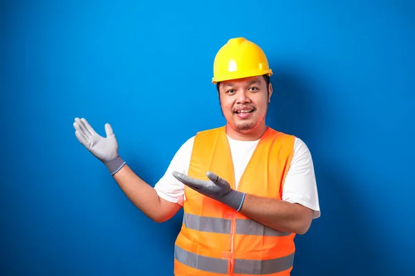 Fat Asian Worker Wearing Helmet Presents Something His Hand While — Stock Photo, Image