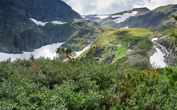 view of the mountainside with glaciers and waterfalls. Altai Russia