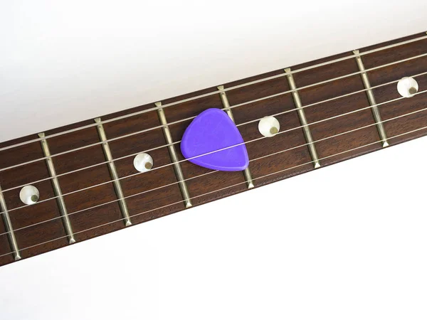 Guitar neck and fretboard with a guitar pick