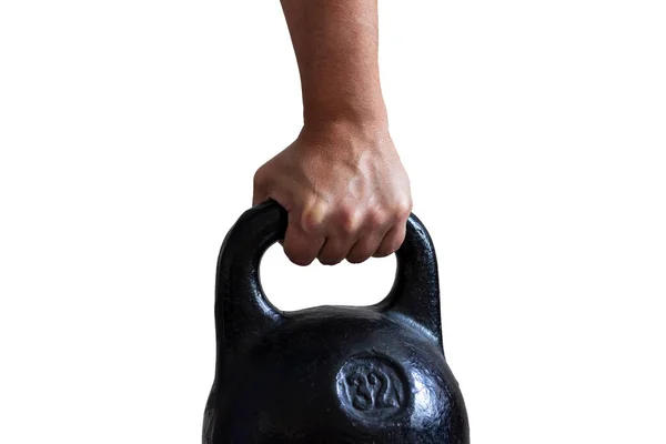 Άνδρας Χέρι Κρατώντας Μαύρο Χυτοσίδηρο Αθλητικά Kettlebell Απομονωθεί — Φωτογραφία Αρχείου
