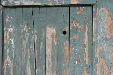 Yeşil boyalı eski ahşap tahtaların yüzeyi..