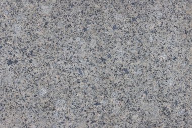 Parlatılmış granitten yapılmış doğal bir taş levhanın dokusu..