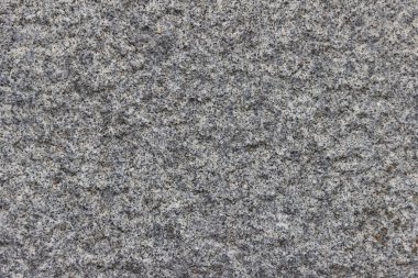 Parlatılmış granitten yapılmış doğal bir taş levhanın dokusu..