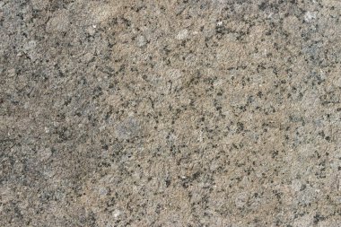 Parlatılmış granitten yapılmış doğal bir taş levhanın dokusu..