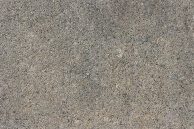 Parlatılmış granitten yapılmış doğal bir taş levhanın dokusu..
