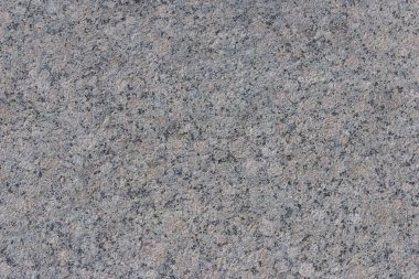Parlatılmış granitten yapılmış doğal bir taş levhanın dokusu..