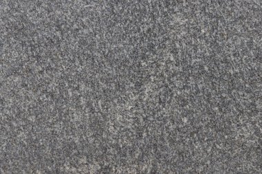 Parlatılmış granitten yapılmış doğal bir taş levhanın dokusu..