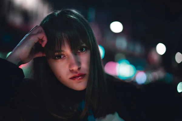 A portrait of young beautiful woman with bangs