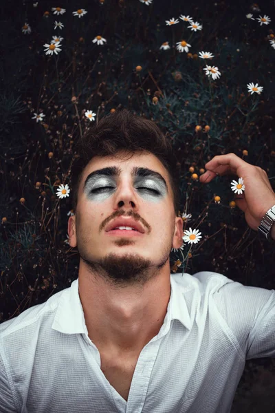 Make-up man with flower background