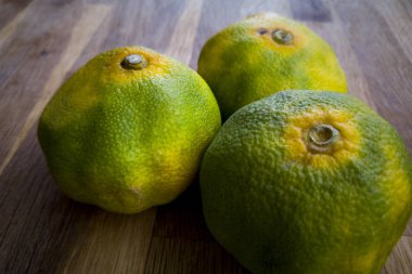 organic mandarins on wood table