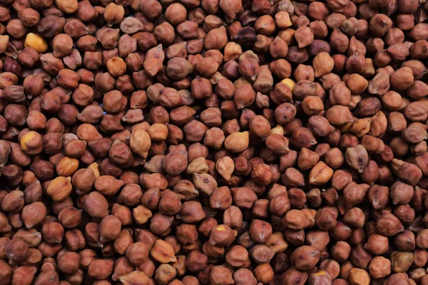 Dried black chickpeas as an abstract background texture