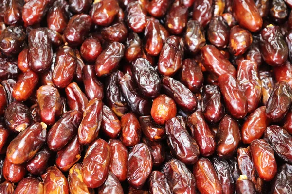 Pile of dates fruits in a shop. Dates fruits backgrounds