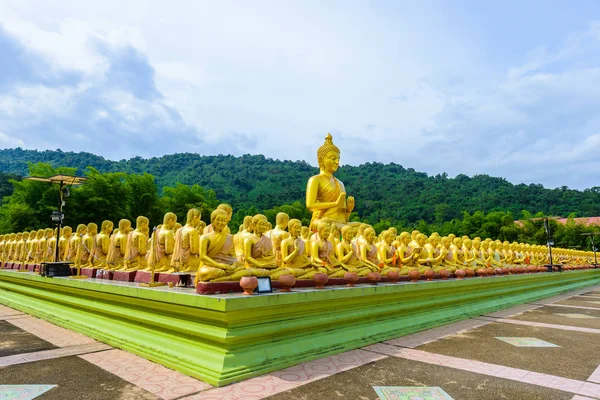 The golden big Buddha statue among small 1,250 Buddha statue at Makha Bucha Buddhist memorial park is built on the occasion of Great period, Buddha 2600 years, nakhon nayok province, Thailand