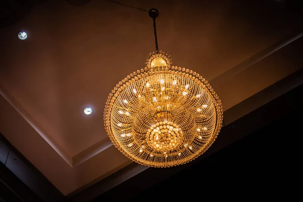 Chrystal chandelier lamp on the ceiling in Dining room. Decorative elegant vintage and Contemporary interior Concept