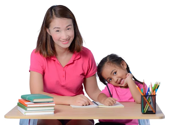 Joven maestro ayudando a niño con lección de escritura aislado en whit —  Fotos de Stock