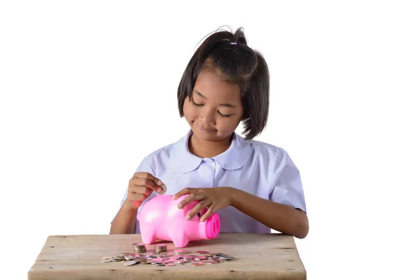 Sevimli Asya kız koyarak paralar içine Piggy banka izole üzerinde beyaz — Stok fotoğraf