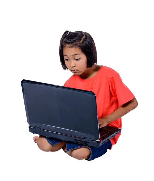 Cute little Asian girl child sitting on the floor studying or us — Stock Photo, Image